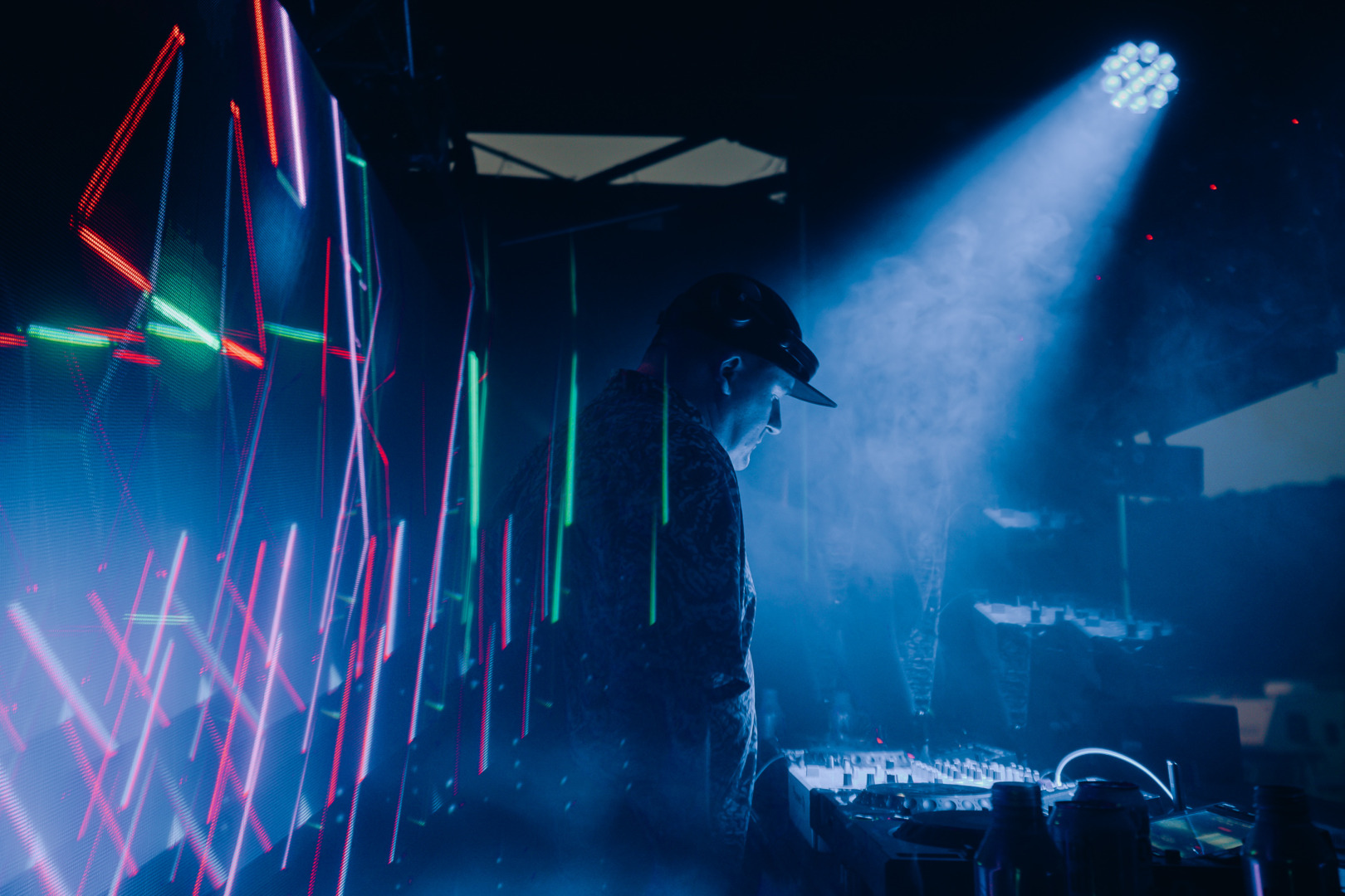 Blue hue picture, djing in a dark room