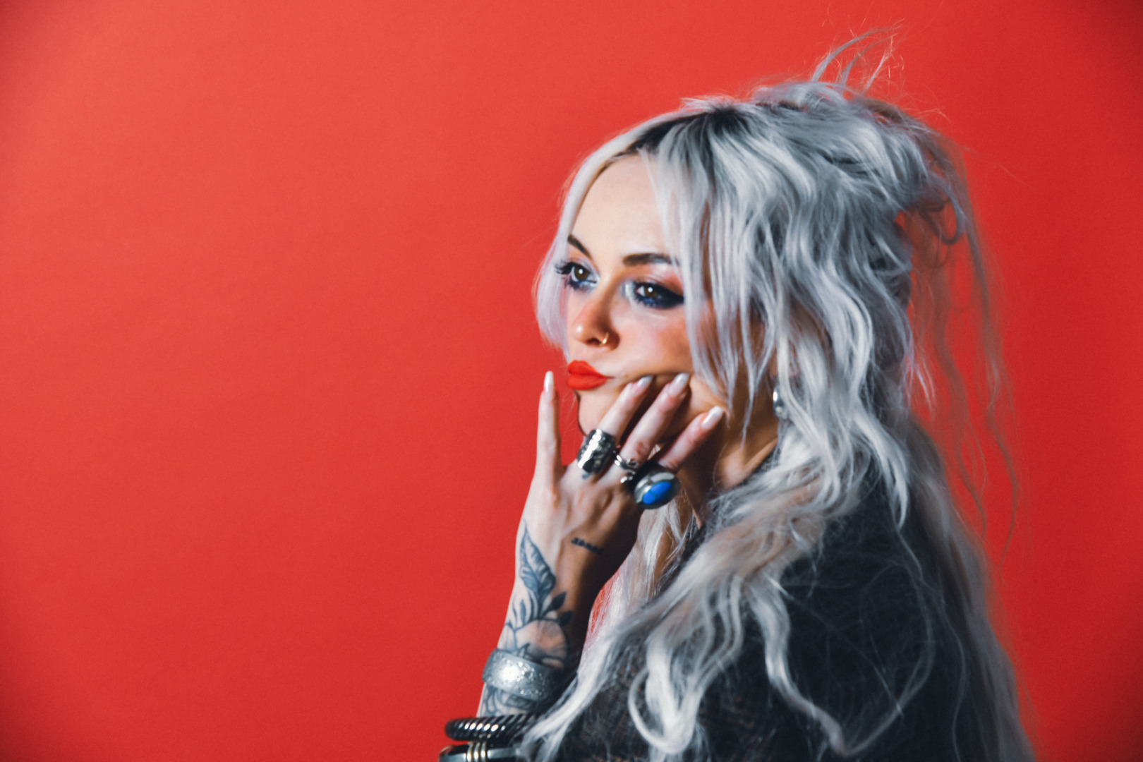 Brieanna posing on a red back ground