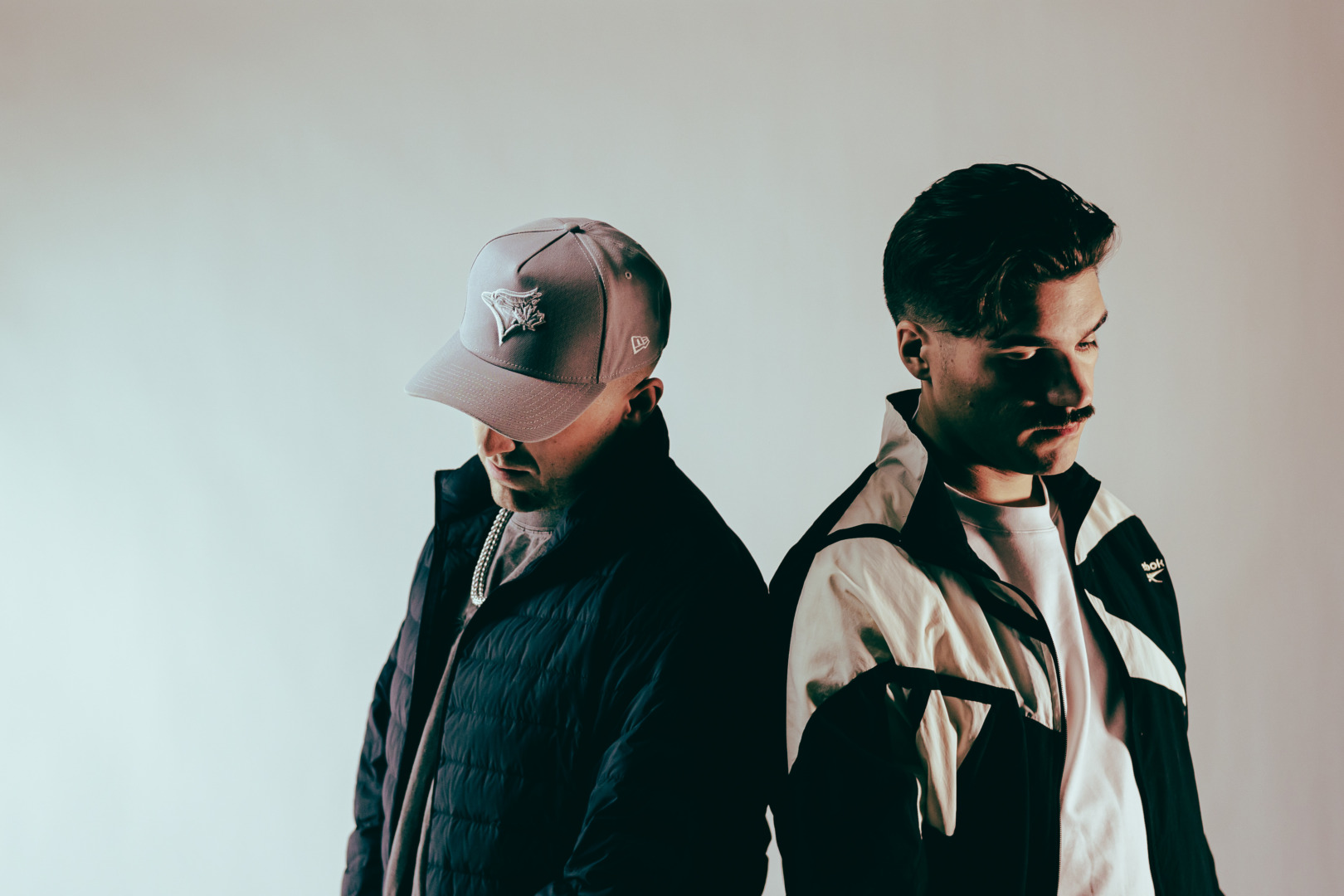 Control Room standing together leaning on each other upon a white back ground