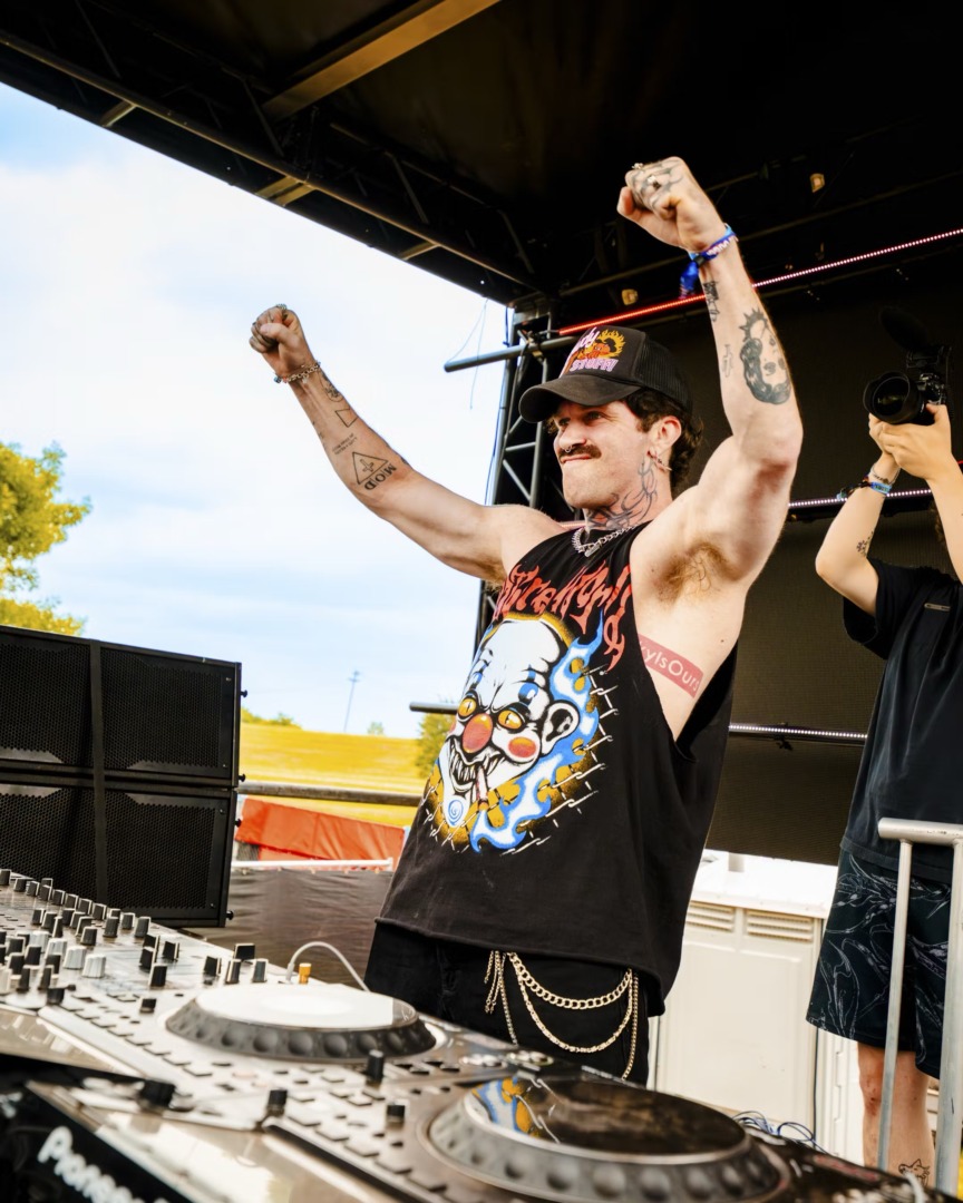 DeadX raising his fists to the crowd