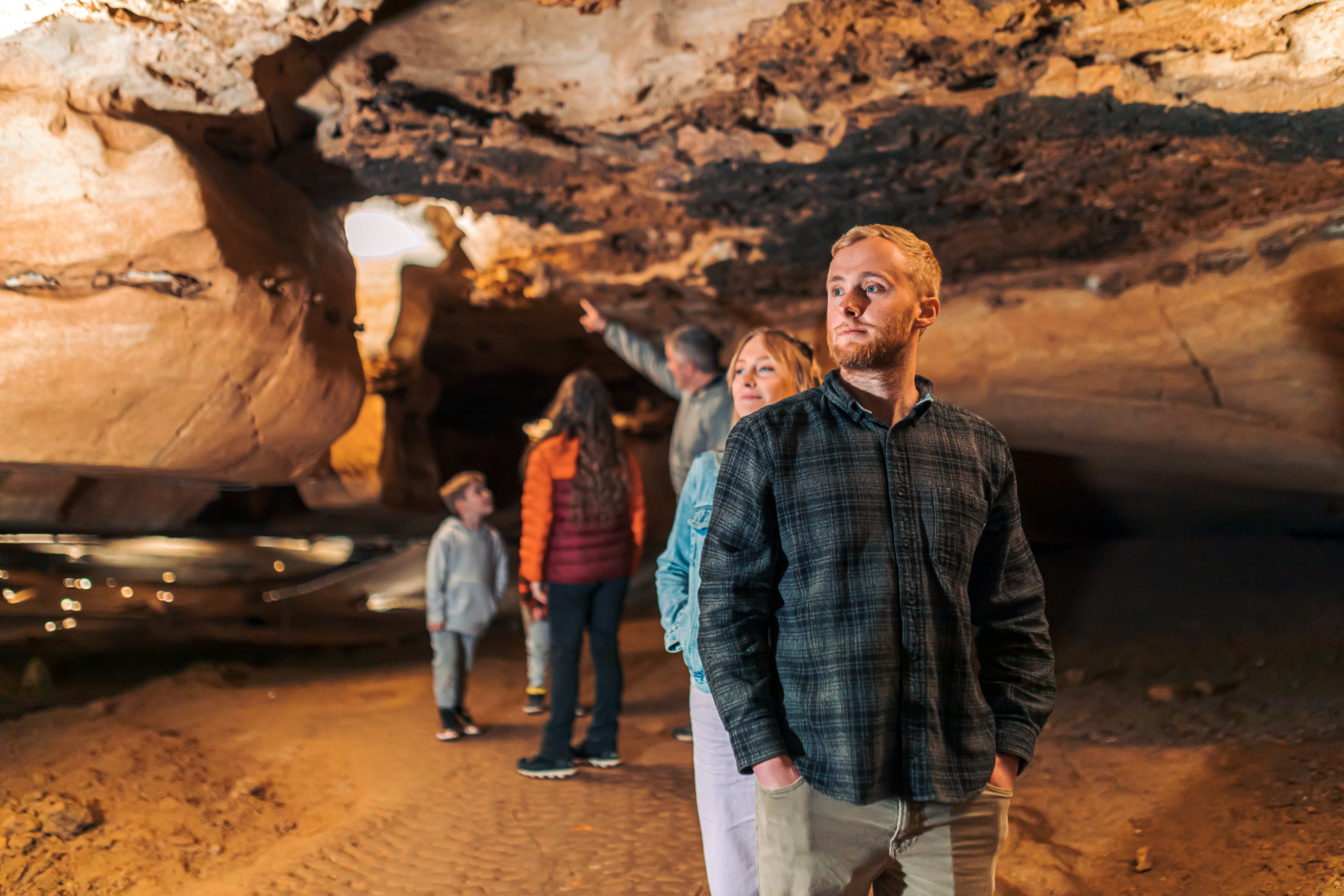 Picture of people standing in the big room on a cave tour