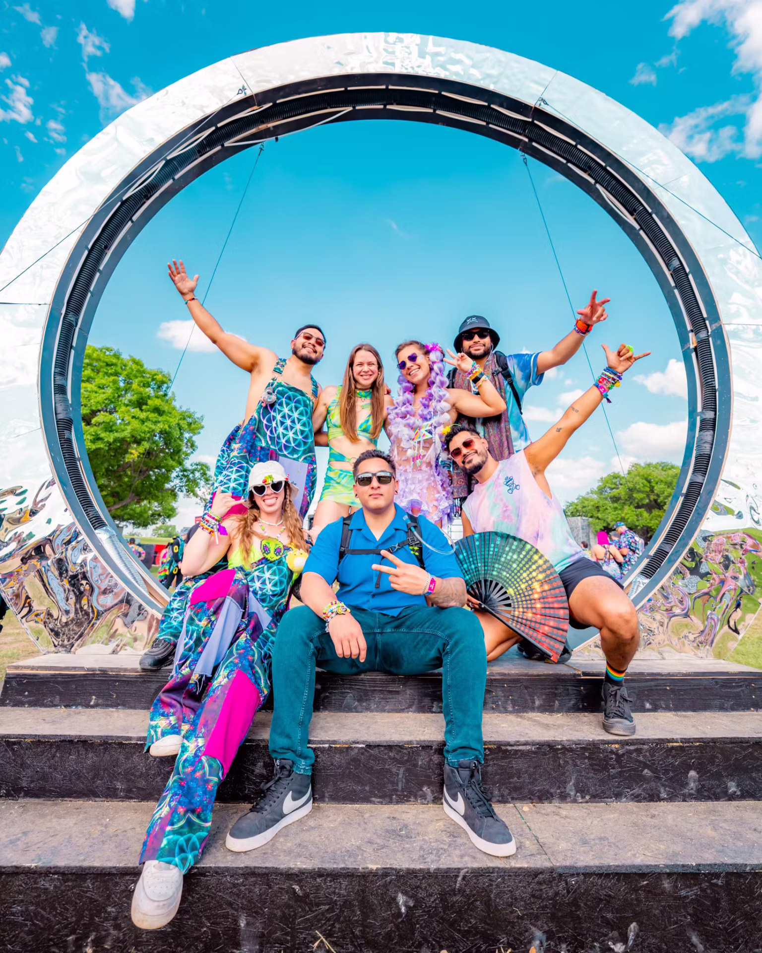 Group photo posing in front of a portal