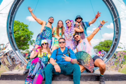 Group photo posing in front of a portal