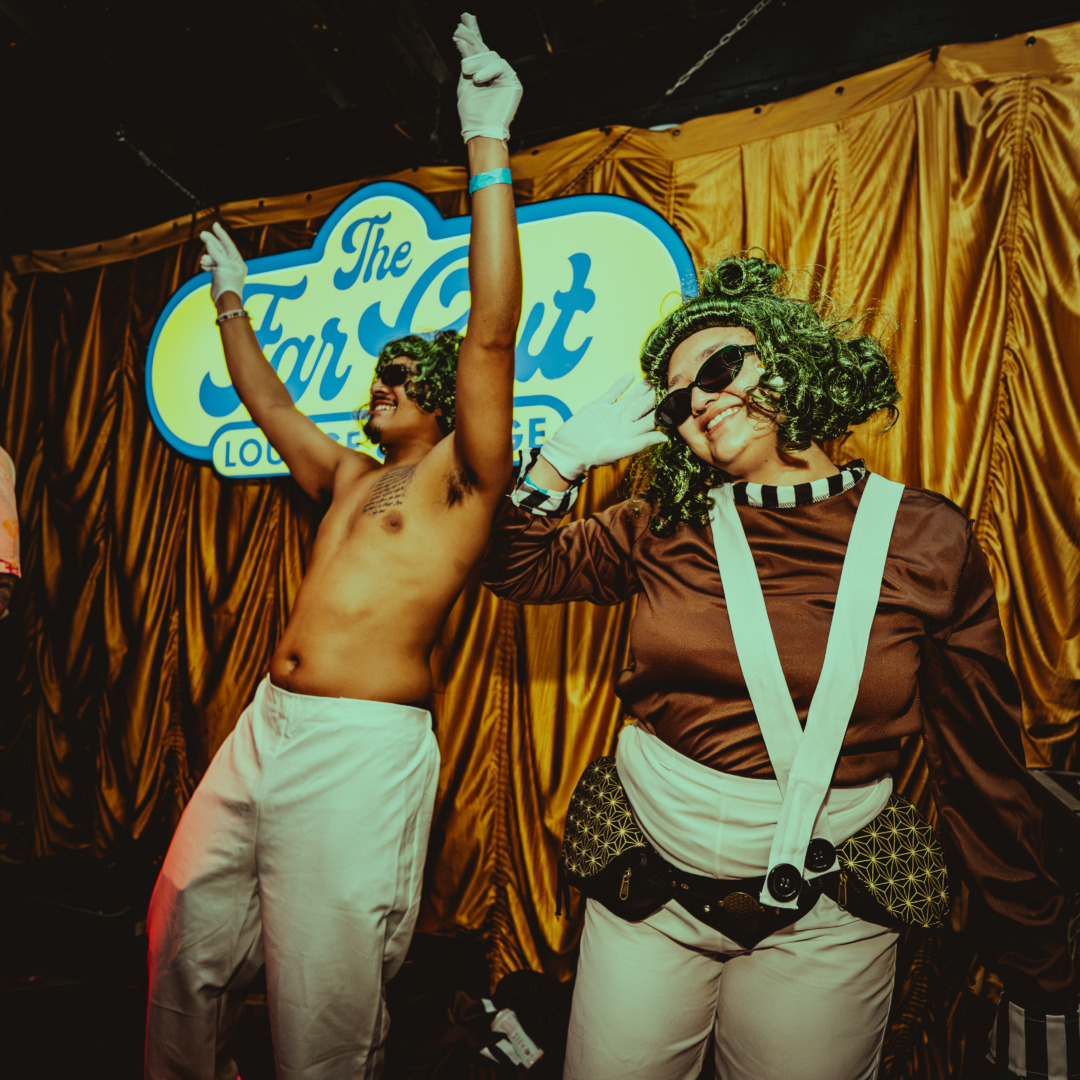 two oompa loompas dancing on stage