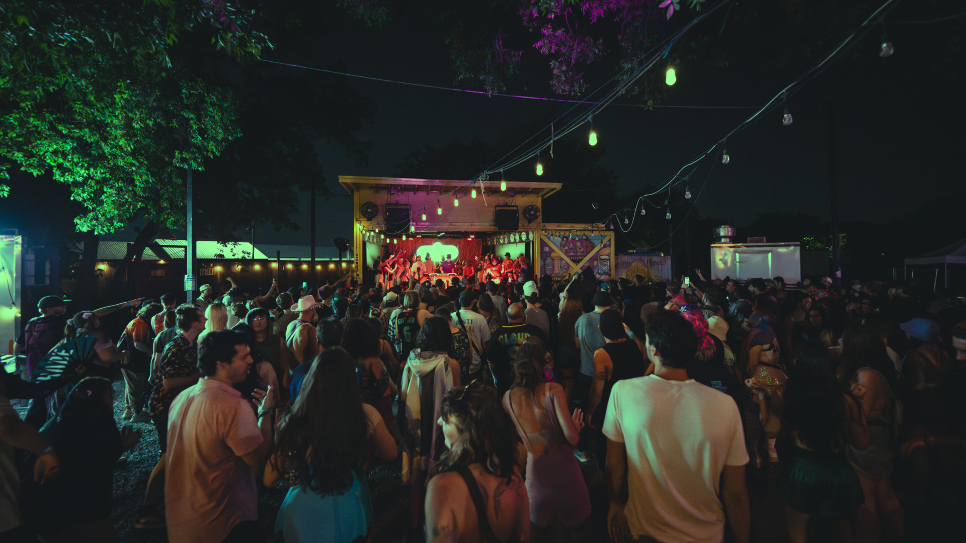 pakced crowd surroudning the small stage