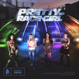 three girls standing infront of race cars