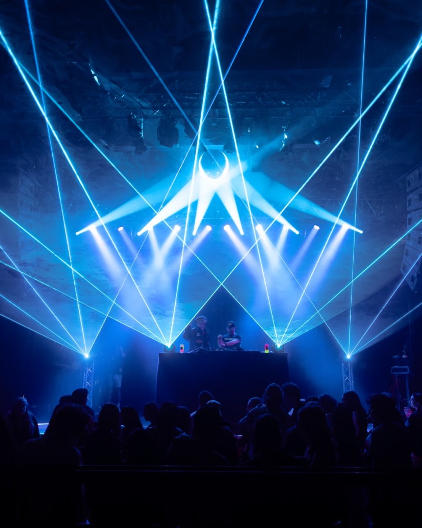Blue lasers upon a black background